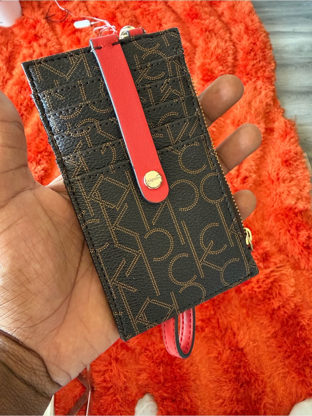 Calvin Klein Brown Monogram Phone Wallet with Red Strap Accent